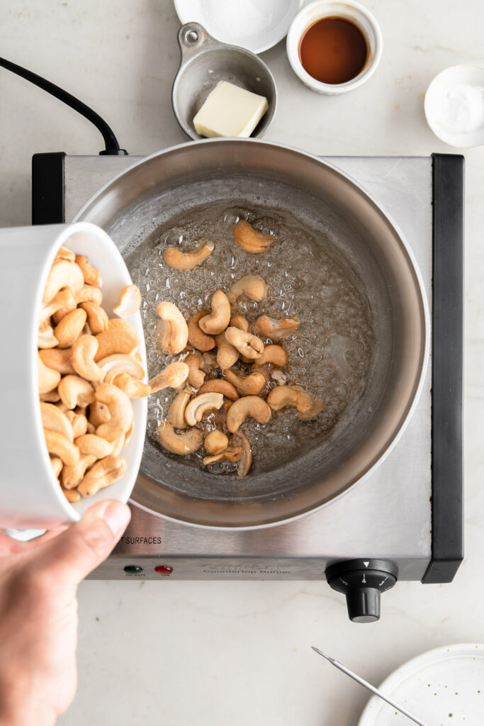 2_adding cashews to syrup at softball stage