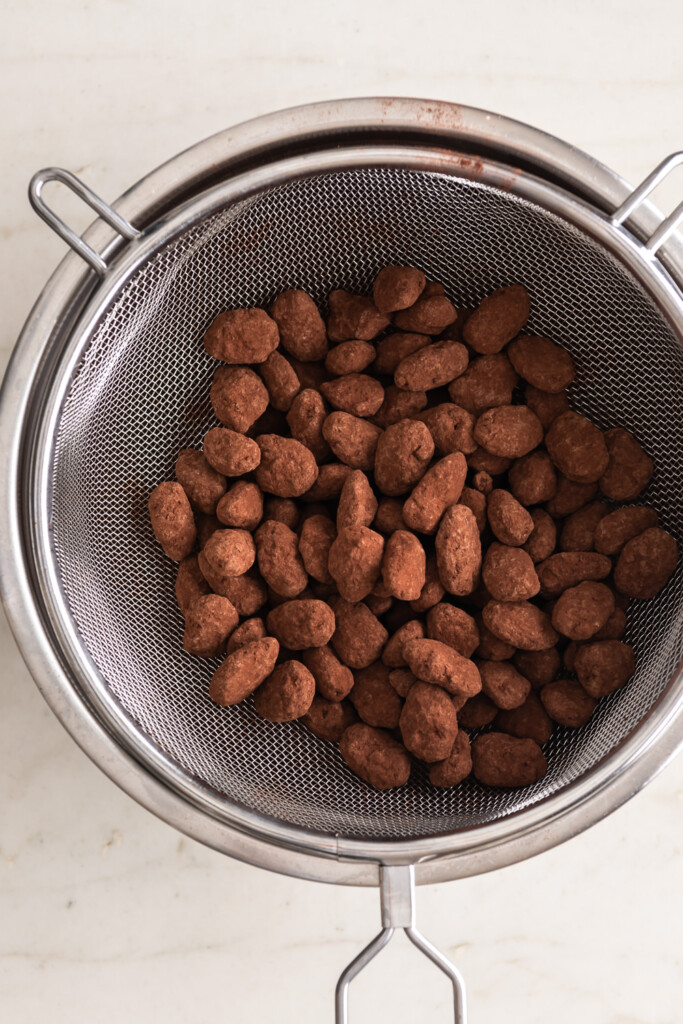 12_toss chocolate almonds with cocoa powder, strain off excess