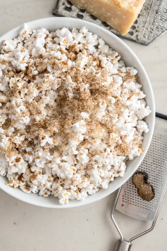 3_grate truffle over popcorn with parmesan