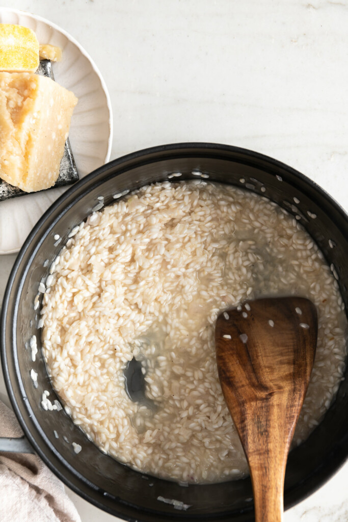 2_stirring white wine into risotto