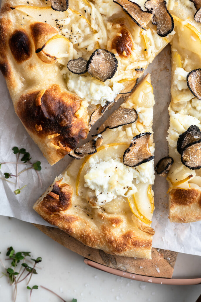 black truffle pizza recipe with honey, pears and ricotta