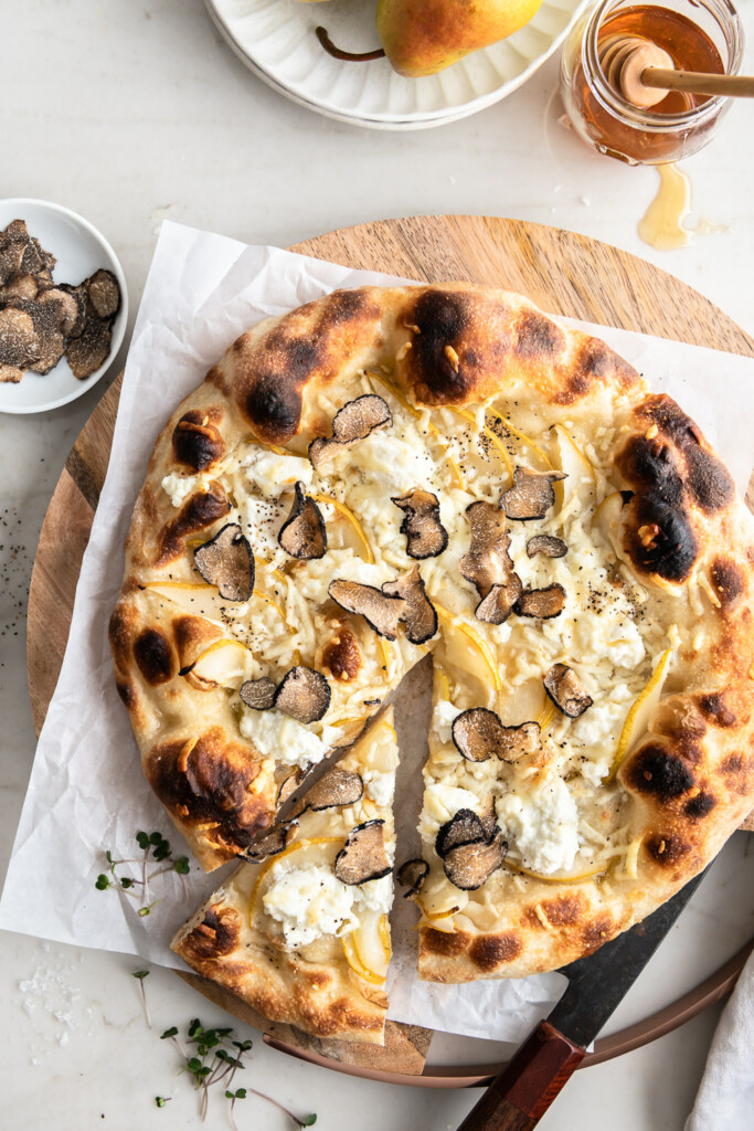 black truffle pizza with pears and ricotta