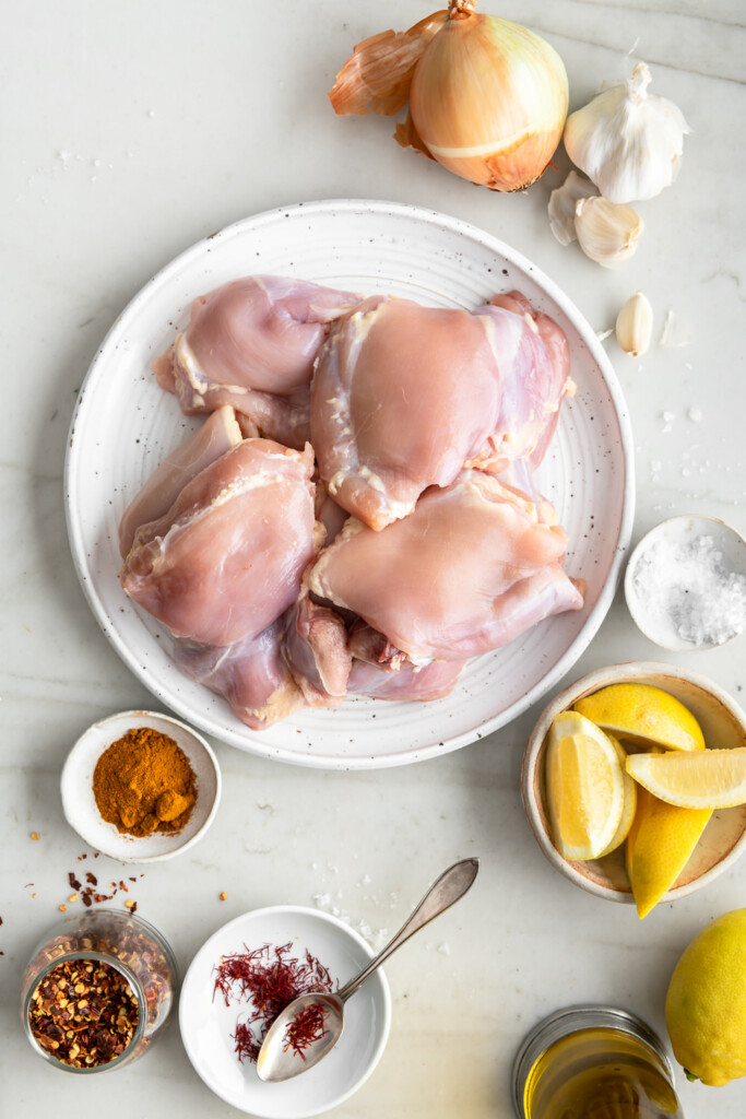 ingredients_chicken thighs, lemon, turmeric, saffron, chile flakes, onion, garlic