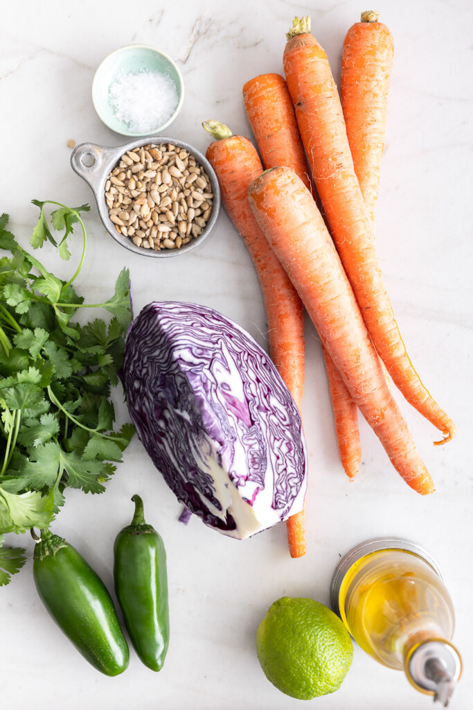 ingredients_carrots, cabbage, jalapenos, limes, sunflower seeds, cilantro