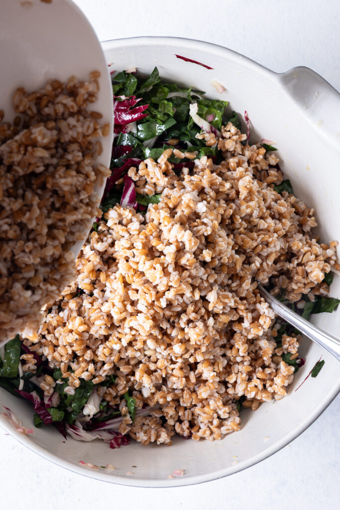 3_add cooked farro to kale and dressing